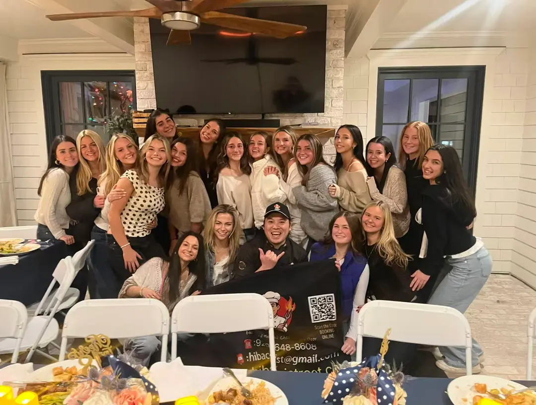 Guests celebrating with their Onsite Hibachi chef after a private party