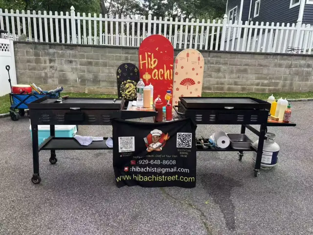 Two outdoor hibachi grills ready for an event