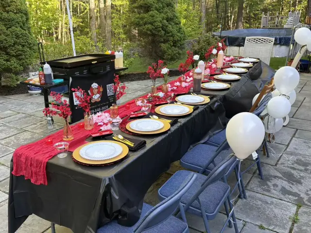 An outdoor dinner table ready for hibachi guests