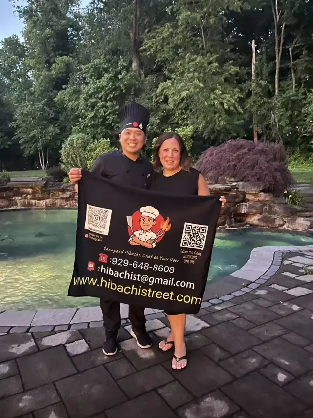 An Onsite Hibachi chef standing with a guest after their event